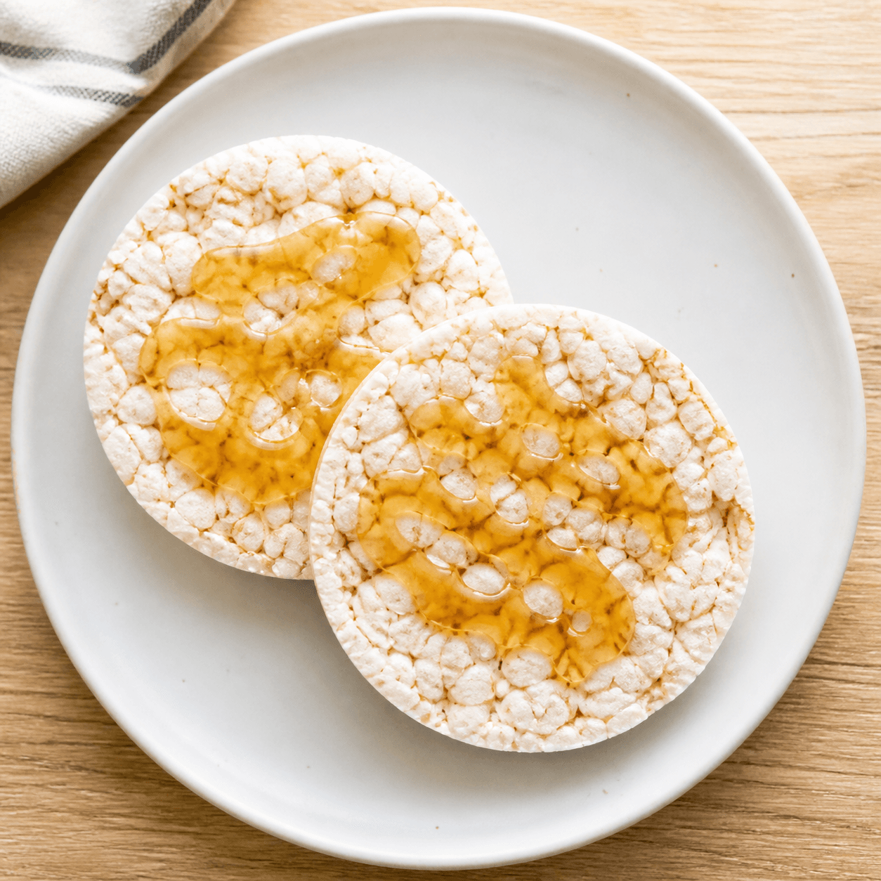 Two rice cakes drizzled with honey