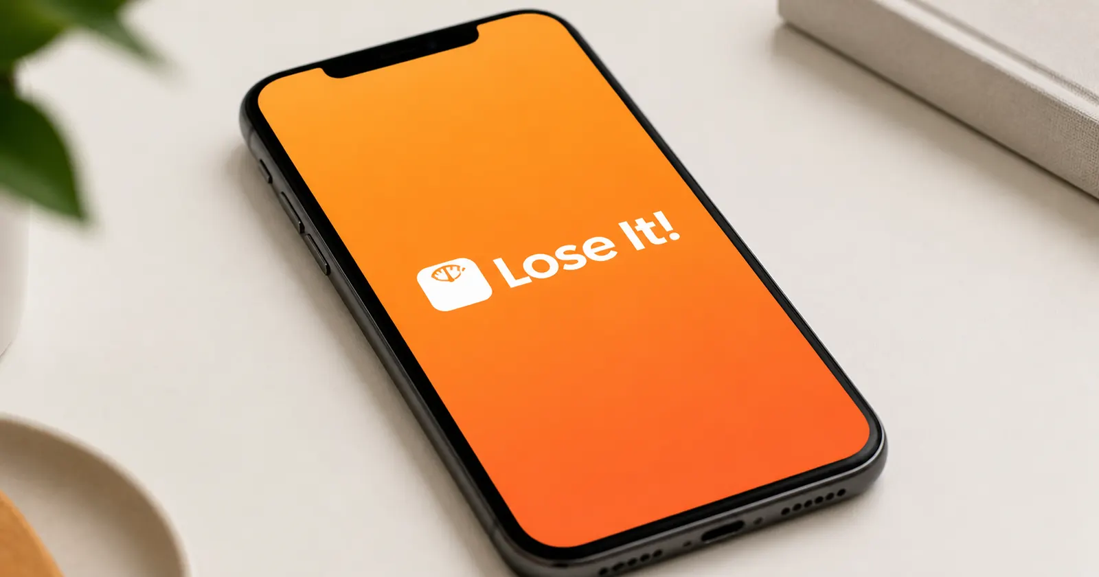 A close-up of an iPhone screen showing the Lose It! logo