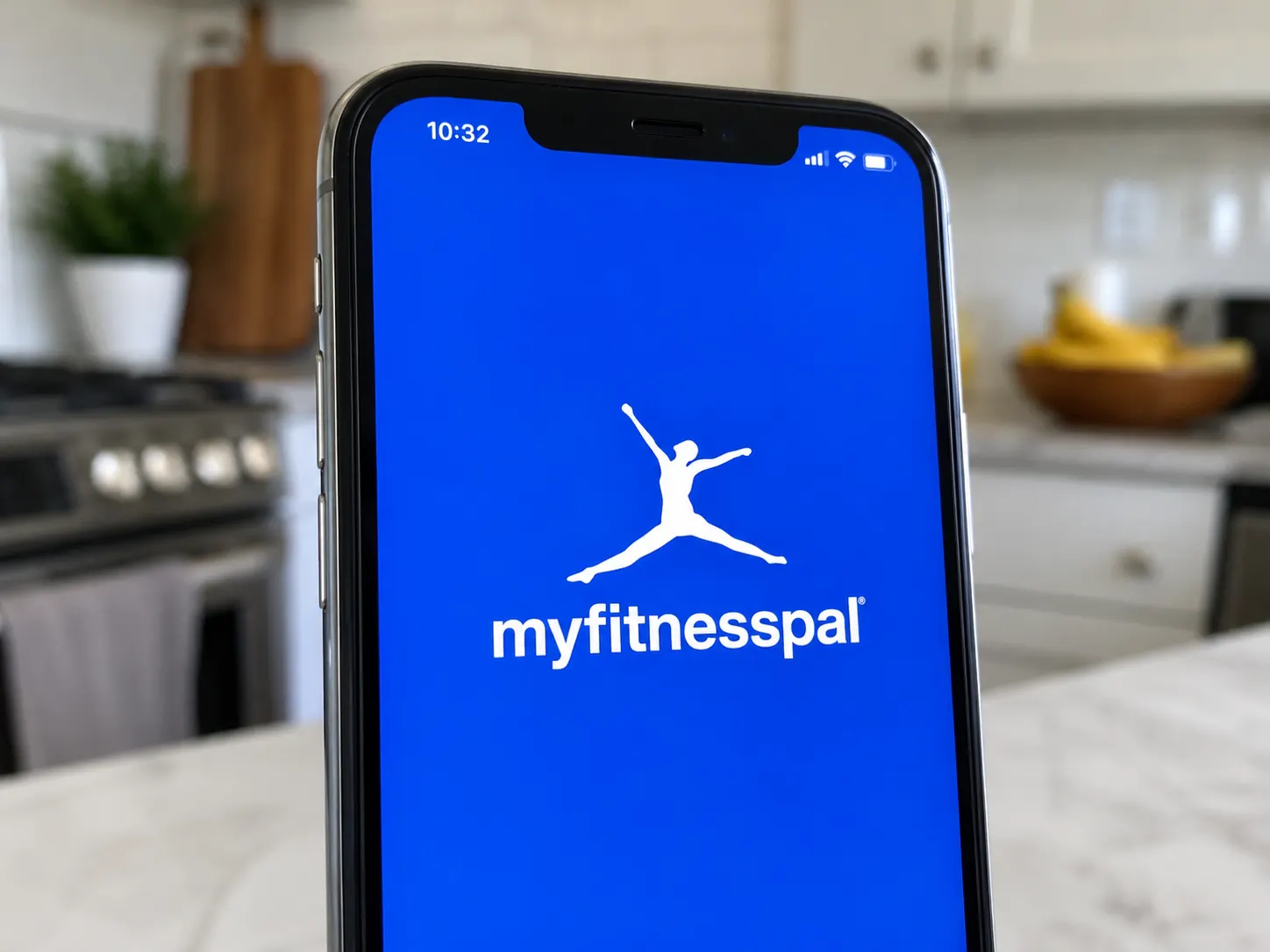 A close-up of an iPhone screen showing the MyFitnessPal logo